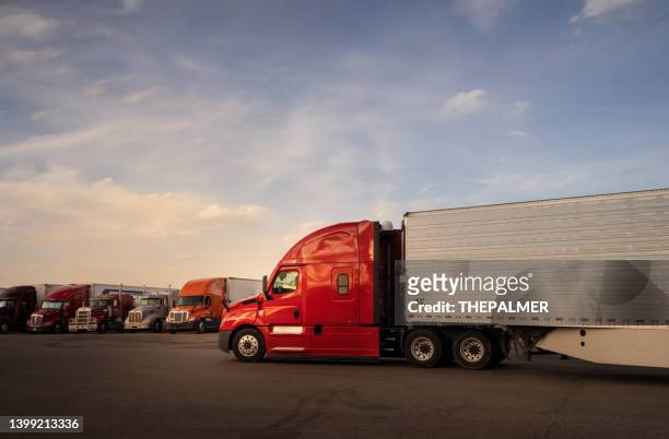 big red semi trailer entering a truk stop resting area in utah, usa - refrigeration transport stock pictures, royalty-free photos & images
