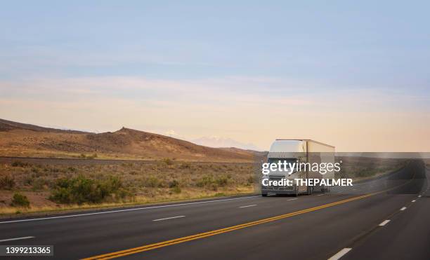 refrigerated white semi trailer transporting commercial cargo, trucking in usa - refrigerator truck stock pictures, royalty-free photos & images