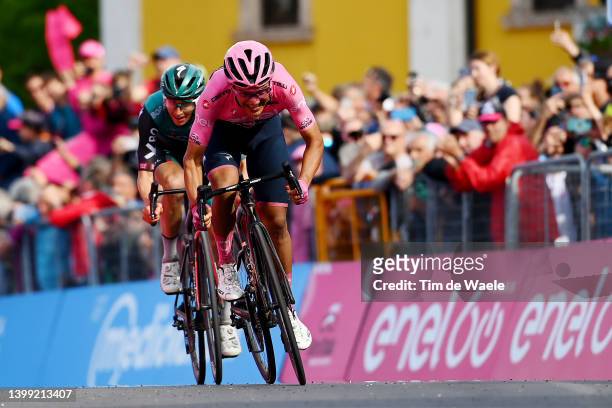 Richard Carapaz of Ecuador and Team INEOS Grenadiers pink leader jersey crosses the finishing line ahead of Jai Hindley of Australia and Team Bora -...