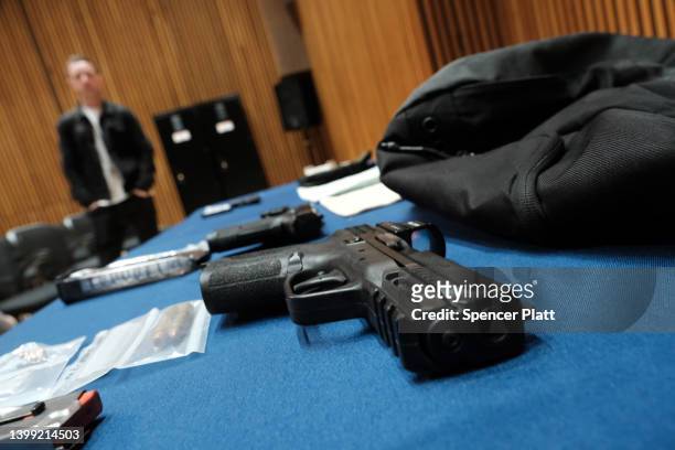 Guns confiscated at New York City public schools are displayed at a news conference with Mayor Eric Adams at police headquarters to speak about guns...