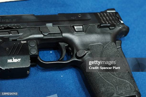 Guns confiscated at New York City public schools are displayed at a news conference with Mayor Eric Adams at police headquarters to speak about guns...