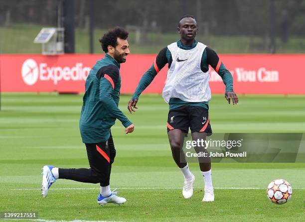 Mohamed Salah of Liverpool and Sadio Mane of Liverpool during a training session at AXA Training Centre on May 25, 2022 in Kirkby, England.