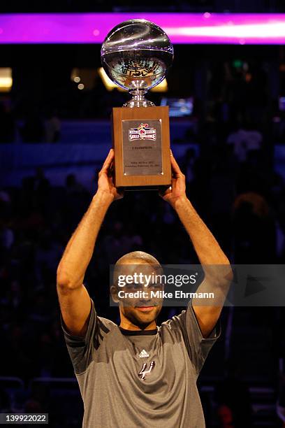 Tony Parker of the San Antonio Spurs celebrates with the trophy after he won the Taco Bell Skills Challenge part of 2012 NBA All-Star Weekend at...