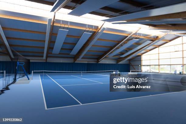 empty indoor tennis court - racket sport stock pictures, royalty-free photos & images