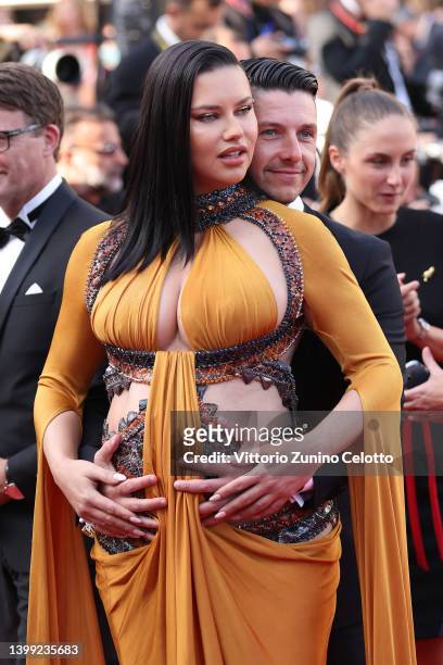 Adriana Lima and Andre Lemmers attend the screening of "Elvis" during the 75th annual Cannes film festival at Palais des Festivals on May 25, 2022 in...