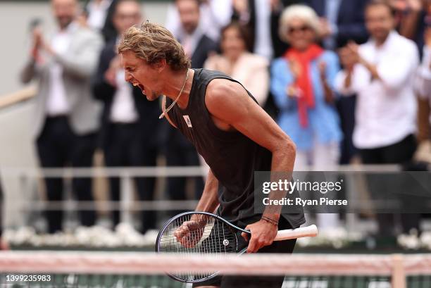 Alexander Zverev of Germany celebrates match point against Sebastien Baez of Argentina during the Men's Singles Round 2 on Day Four of The 2022...