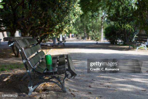 bench with soda can - zaragoza city stock pictures, royalty-free photos & images