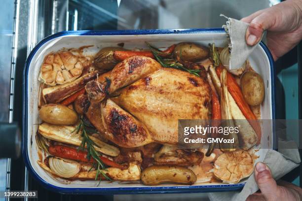 roasted chicken with root vegetables - roasted chicken stock pictures, royalty-free photos & images