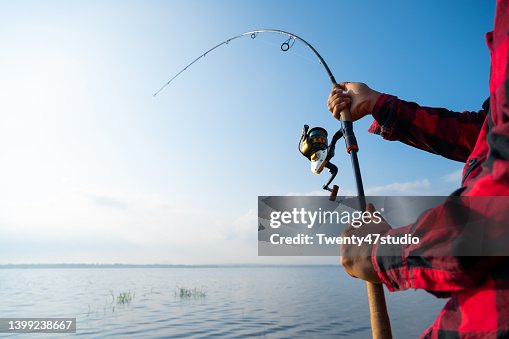Closeup man fishing in the lake Closeup man fishing in the lake