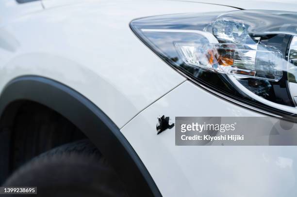 scratch on the car bumper - scratched car stock pictures, royalty-free photos & images