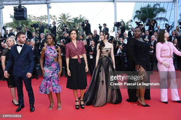 Maimouna Doucoure, Deborah Lukumuena, Anamarie Vartolmei and guests attend the screening of "Elvis" during the 75th annual Cannes film festival at...