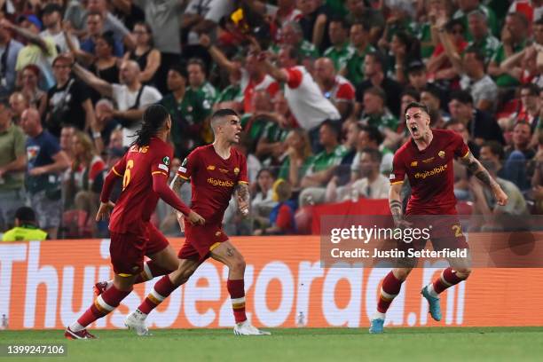 Nicolo Zaniolo celebrates with Roger Ibanez and Chris Smalling of AS Roma after scoring their team's first goal during the UEFA Conference League...
