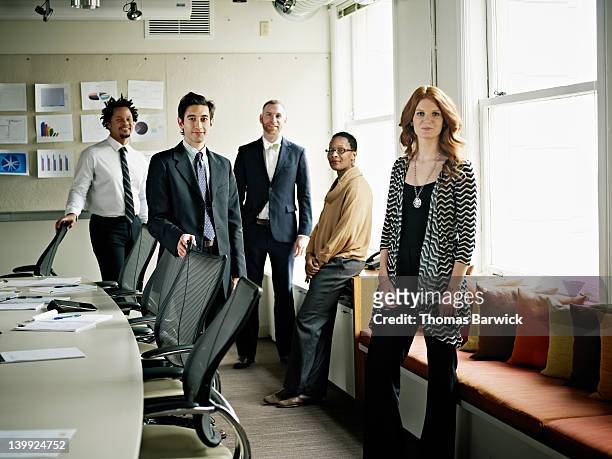 portrait of coworkers standing in conference room - five people stock pictures, royalty-free photos & images