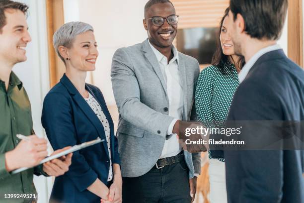business people shaking hands - coalition stock pictures, royalty-free photos & images