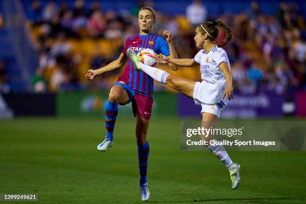 Melanie Serrano of FC Barcelona battles for the ball with Maite Oroz of Real Madrid CF during La copa de La Reina semifinal match between FC...