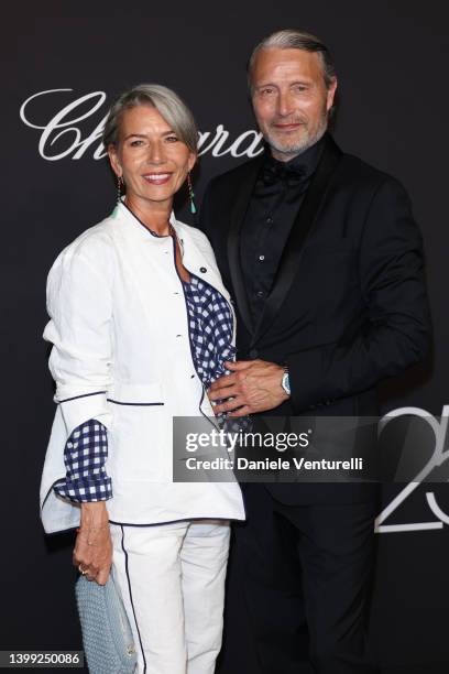 Hanne Jacobsen and Mads Mikkelsen attend "Chopard Loves Cinema" Gala Dinner at Hotel Martinez on May 25, 2022 in Cannes, France.