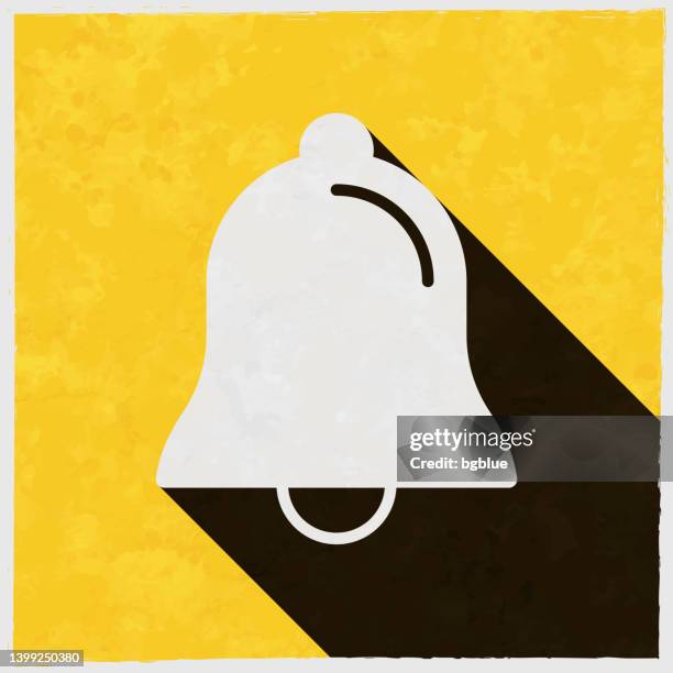 illustrazioni stock, clip art, cartoni animati e icone di tendenza di campana. icona con ombra lunga su sfondo giallo strutturato - campanile orologio