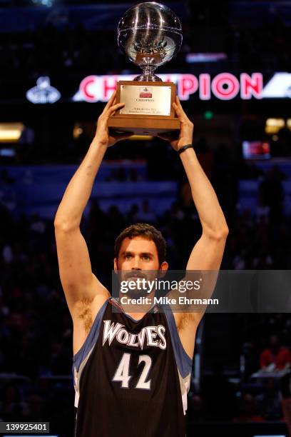 Kevin Love of the Minnesota Timberwolves celebrates with the trophy after he won the Foot Locker Three-Point Contest part of 2012 NBA All-Star...