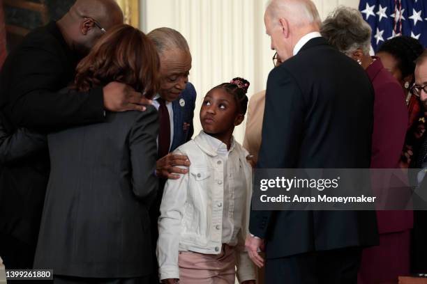 President Joe Biden, U.S. Vice President Kamala Harris and Rev. Al Sharpton speak to Gianna Floyd, the daughter of George Floyd, after an executive...