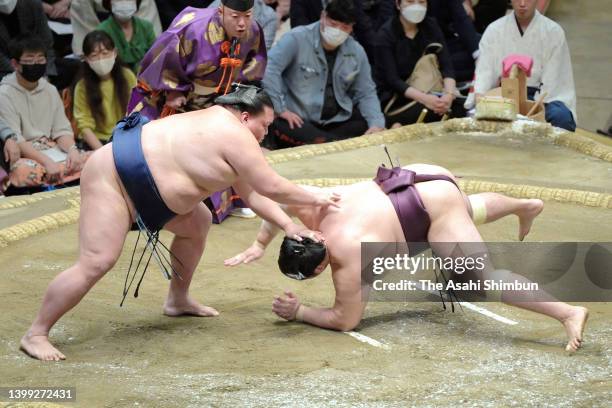 Ozeki Mitakeumi throws Endo to win during day eight of the Grand Sumo Summer Tournament at Ryogoku Kokugikan on May 15, 2022 in Tokyo, Japan.