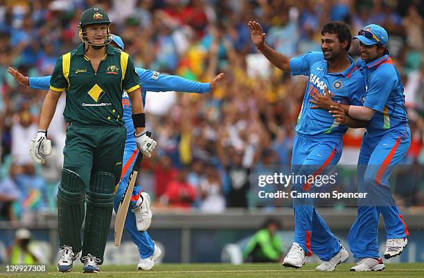 Praveen Kumar of India is congratulated by team mates after dismissing Shane Watson of Australia during the One Day International match between...