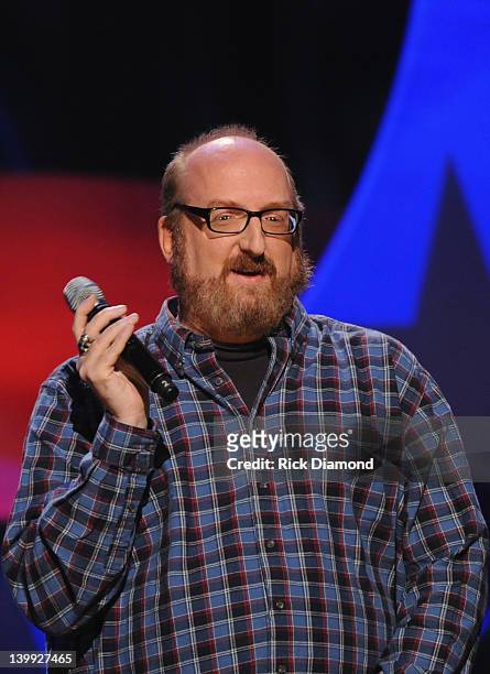 Comedian Brian Posehn performs as part of CMT Presents Ron White's Comedy Saltue To The Troops at The Grand Ole Opry on February 21, 2012 in...