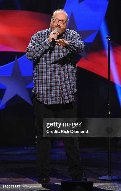 Comedian Brian Posehn performs as part of CMT Presents Ron White's Comedy Saltue To The Troops at The Grand Ole Opry on February 21, 2012 in...