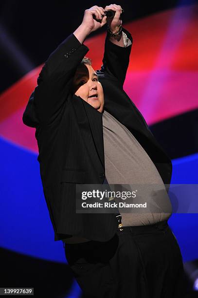 Comedian John Pinette performs as part of CMT Presents Ron White's Comedy Saltue To The Troops at The Grand Ole Opry on February 21, 2012 in...