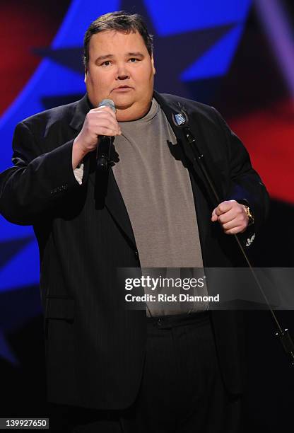 Comedian John Pinette performs as part of CMT Presents Ron White's Comedy Saltue To The Troops at The Grand Ole Opry on February 21, 2012 in...