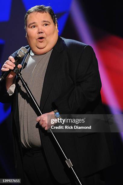 Comedian John Pinette performs as part of CMT Presents Ron White's Comedy Saltue To The Troops at The Grand Ole Opry on February 21, 2012 in...