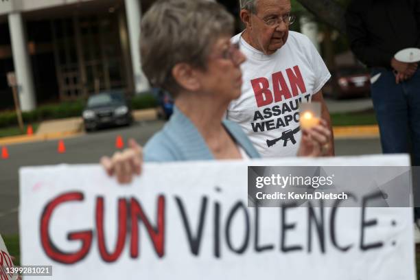 Gun-control advocates hold a vigil outside of the National Rifle Association headquarters following the recent mass shooting at Robb Elementary...