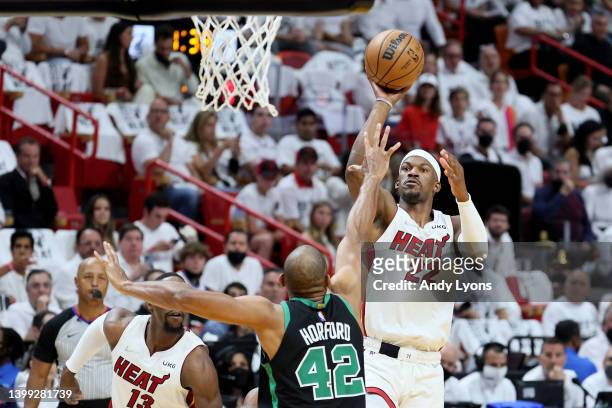Jimmy Butler of the Miami Heat shoots the ball against Al Horford of the Boston Celtics during the first quarter in Game Five of the 2022 NBA...