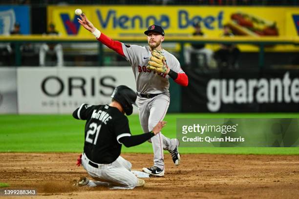 Trevor Story of the Boston Red Sox turns a double play in the third inning against Reese McGuire of the Chicago White Sox at Guaranteed Rate Field on...