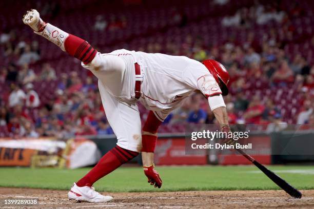 Joey Votto of the Cincinnati Reds dives to avoid being hit by a pitch in the eighth inning against the Chicago Cubs at Great American Ball Park on...