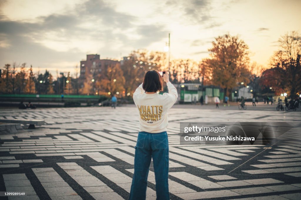 Girl with smart phone,in the park