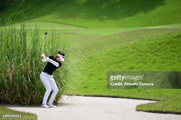 Erika Hara of Japan hits out from a bunker on the 9th hole during the first round of Resorttrust Ladies at Maple Point Golf Club on May 26, 2022 in...
