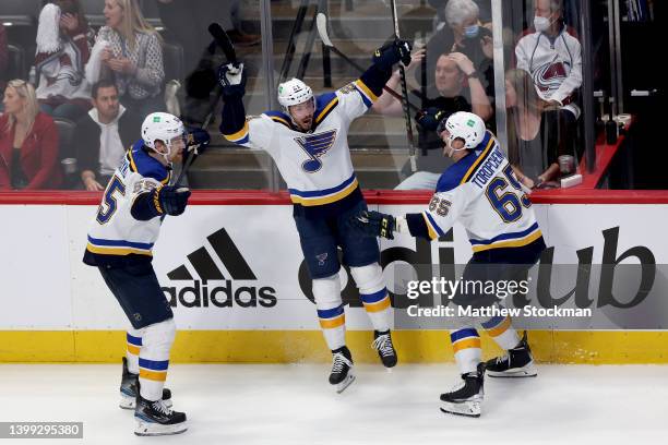 Tyler Bozak the St Louis Blues celebrates with Colton Parayko and Alexei Toropchenko after scoring a goal against the Colorado Avalanche in overtime...