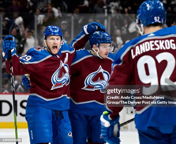 Colorado Avalanche center Nathan MacKinnon celebrates his goal against the St. Louis Blues with teammates Cale Maker and Gabriel Landeskog in the...