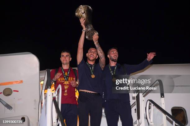 Roma players Lorenzo Pellegrini, Gianluca Mancini and Bryan Cristante arrive in Rome with trophy in the early morning of May 26, 2022 in Rome, Italy.