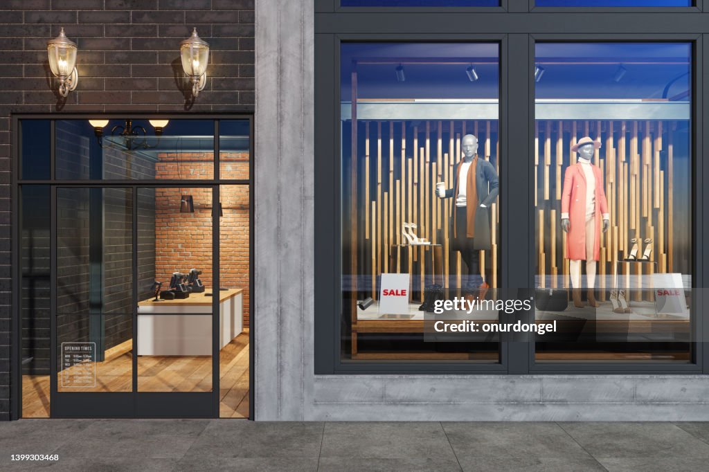Facade Of Clothing Store With Mannequins, Clothes And Shoes Displaying In Showcase