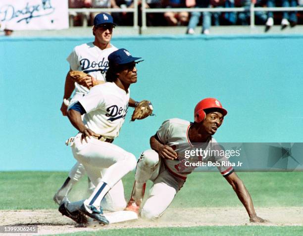 Cardinals Willie McGee is tagged out at 2nd base on throw from Dodgers catcher Mike Scioscia during Los Angeles Dodgers vs St. Louis Cardinals MLB...