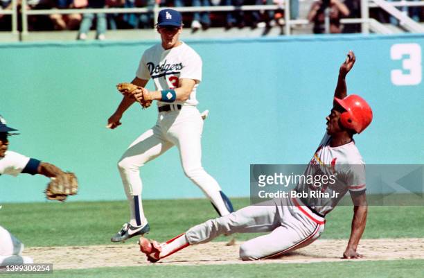 Cardinals Willie McGee is tagged out at 2nd base on throw from Dodgers catcher Mike Scioscia during Los Angeles Dodgers vs St. Louis Cardinals MLB...