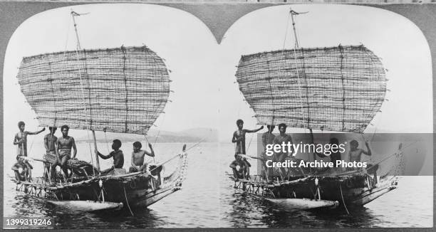 Stereoscopic image showing Papuan men sailing on a traditional Papuan outrigger boat in the southern Pacific waters off the coast of New Guinea,...