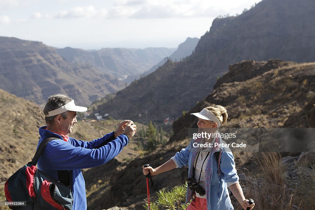 Couple taking a photo while out walking