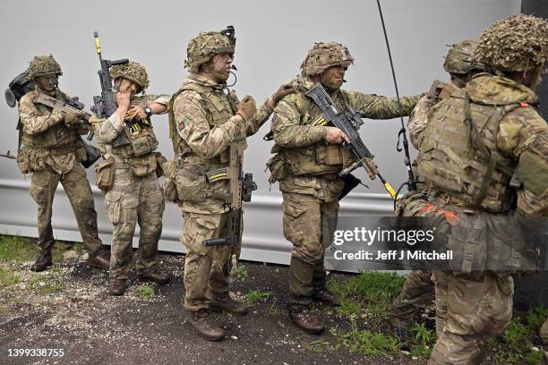 Soldiers from Royal Welsh Battlegroup take part in maneuvers during NATO exercise Hedgehog on the Estonian Latvian border on May 26, 2022 in Voru,...