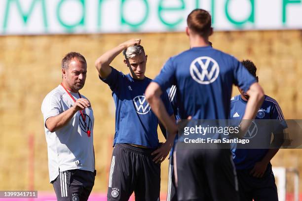 Hansi Flick, manager of Germany looks on during a training session of the German national soccer team on May 26, 2022 in Marbella, Spain.