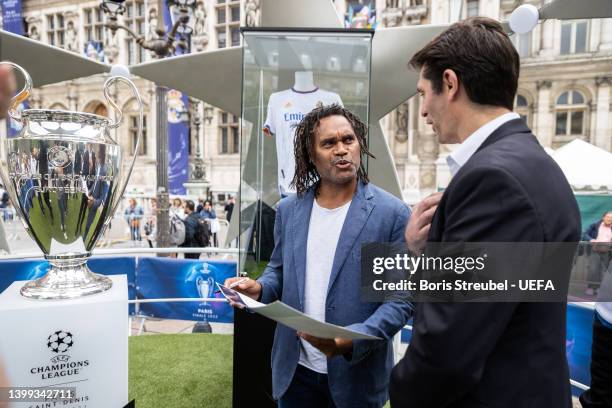 Ambassadors Christian Karembeu and Deputy Mayor in charge of Sport, Olympic and Paralympic Games Pierre Rabadan pose with the trophy at Hotel de...