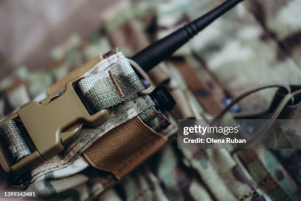 walkie-talkie in tactical load bearing vest. - military uniform close up stock pictures, royalty-free photos & images