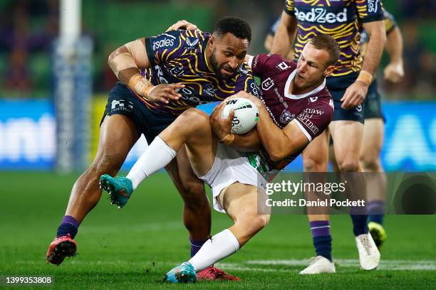 Justin Olam of the Storm is tackled by Daly Cherry-Evans of the Sea Eagles during the round 12 NRL match between the Melbourne Storm and the Manly...