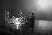Vintage royal crown for man, jewellery. Concept of power and wealth, king. Black and white